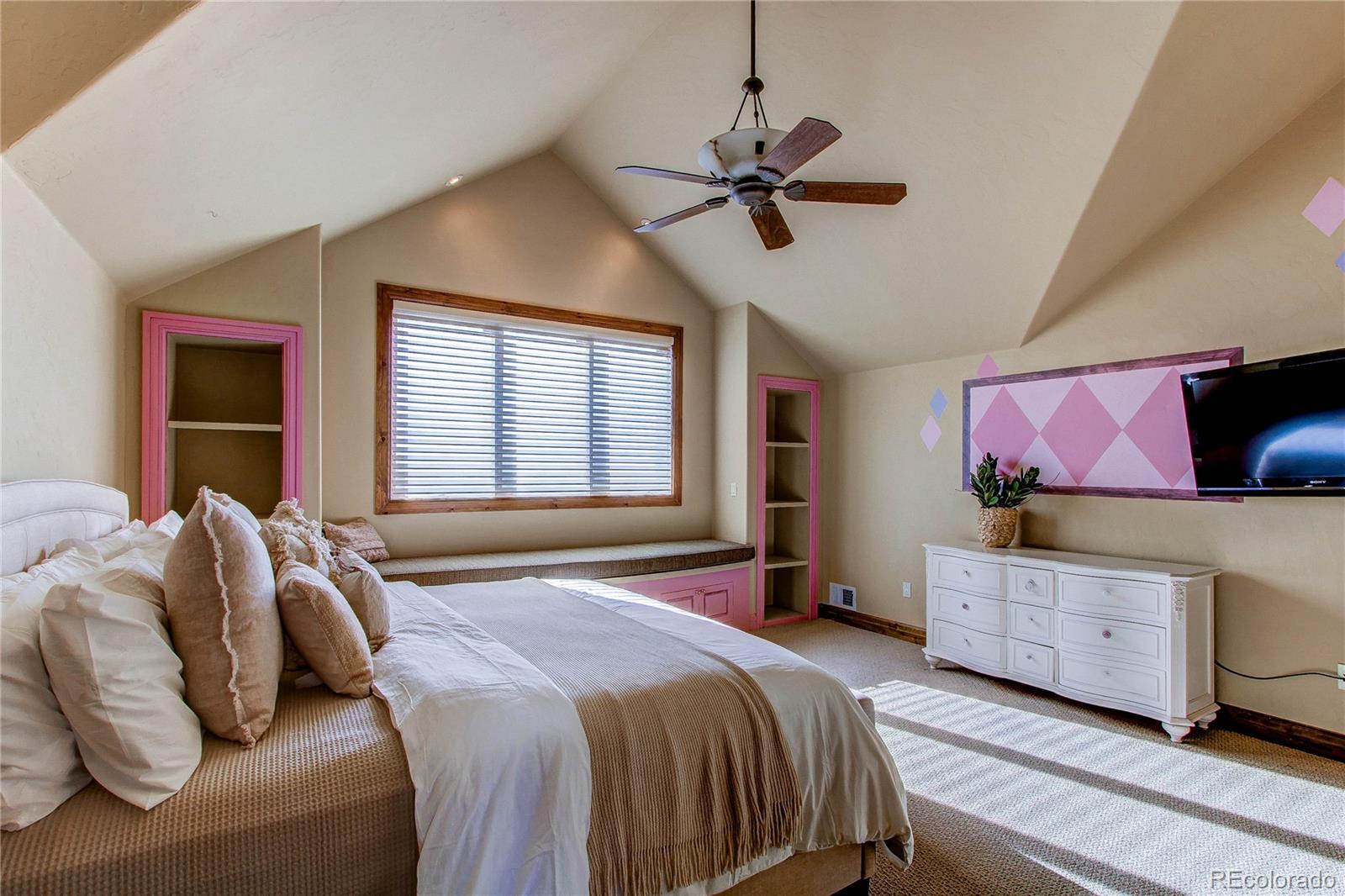 5764 Amber Ridge Drive Castle Pines, CO 80108 - Photo 27 of 50 a bedroom with a bed and window