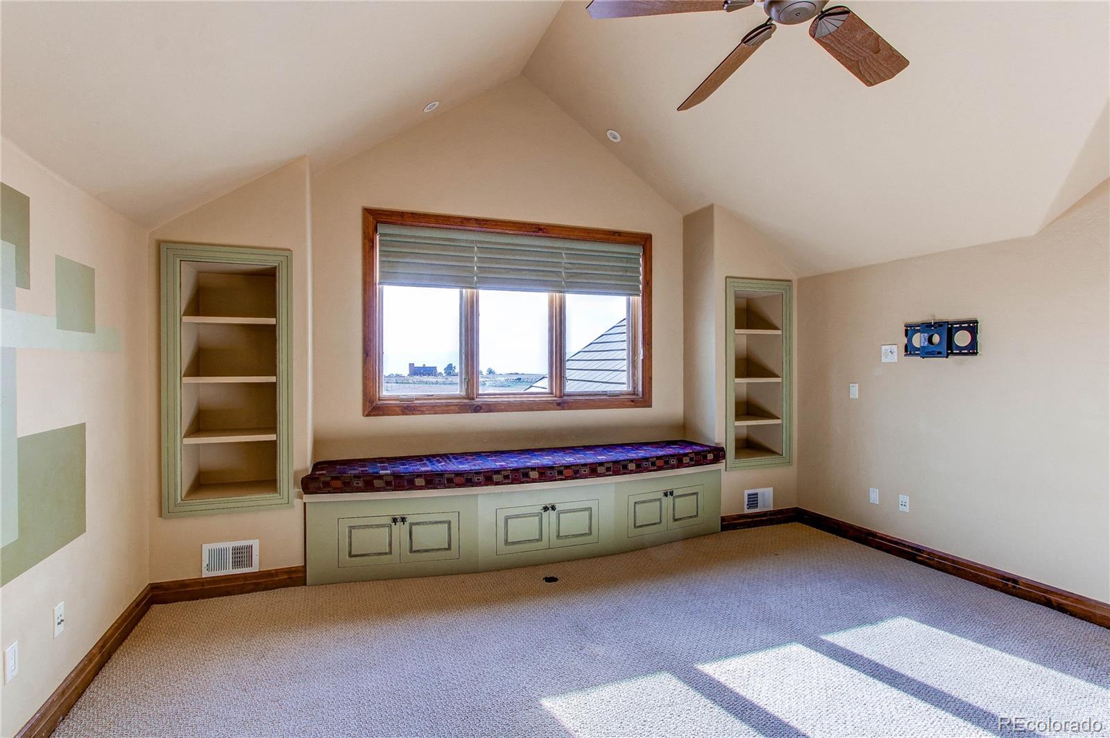 5764 Amber Ridge Drive Castle Pines, CO 80108 - Photo 29 of 50 a living room with furniture and window