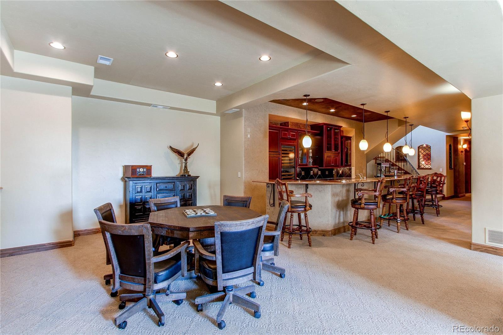 5764 Amber Ridge Drive Castle Pines, CO 80108 - Photo 36 of 50 a view of a dining room with furniture