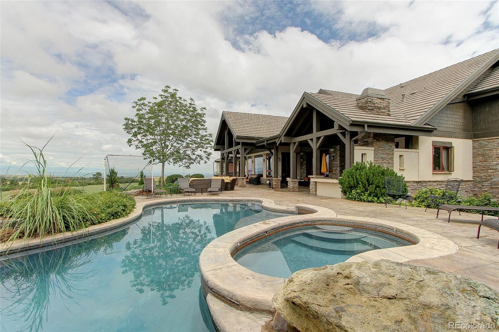 5764 Amber Ridge Drive Castle Pines, CO 80108 - Photo 43 of 50 a view of a house with pool