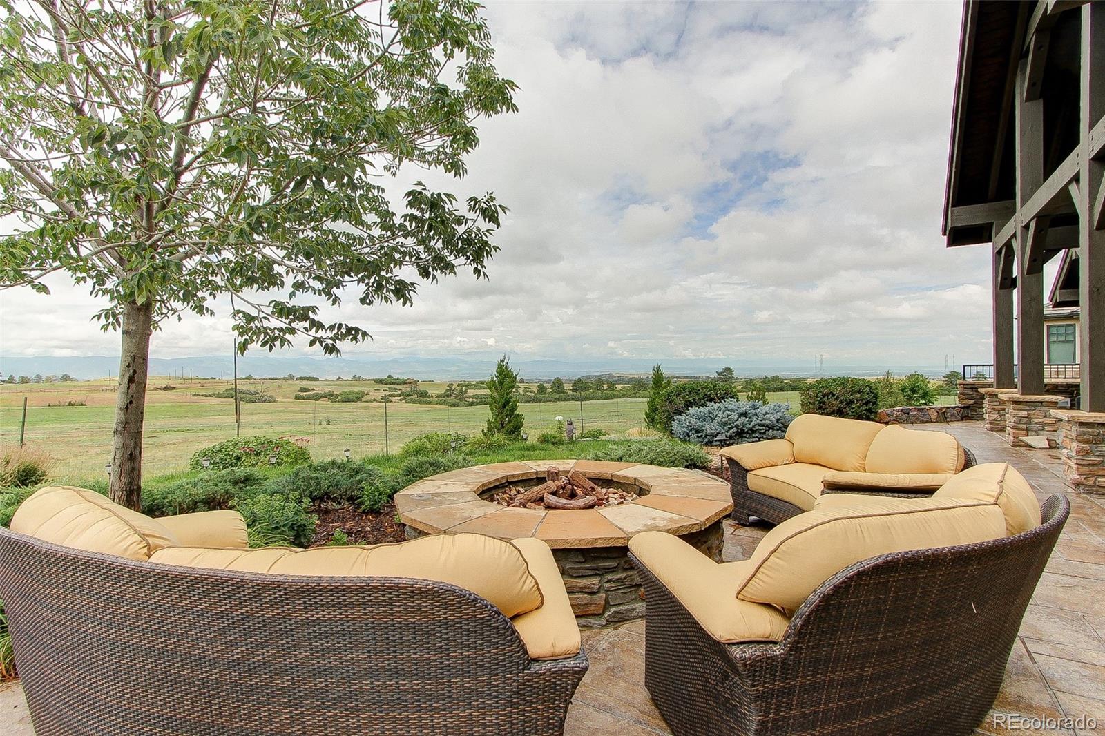 5764 Amber Ridge Drive Castle Pines, CO 80108 - Photo 44 of 50 a view of roof deck with couches and ocean view