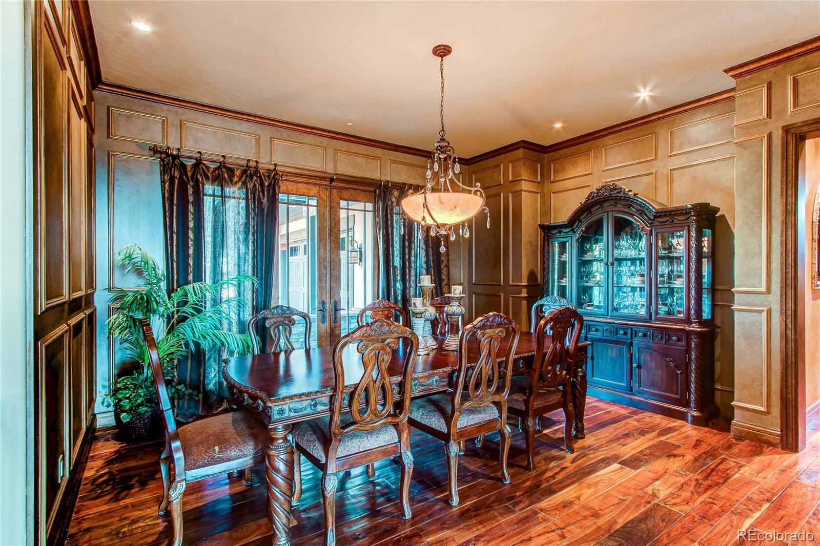 5764 Amber Ridge Drive Castle Pines, CO 80108 - Photo 10 of 50 a view of a dining room with furniture window and outside view