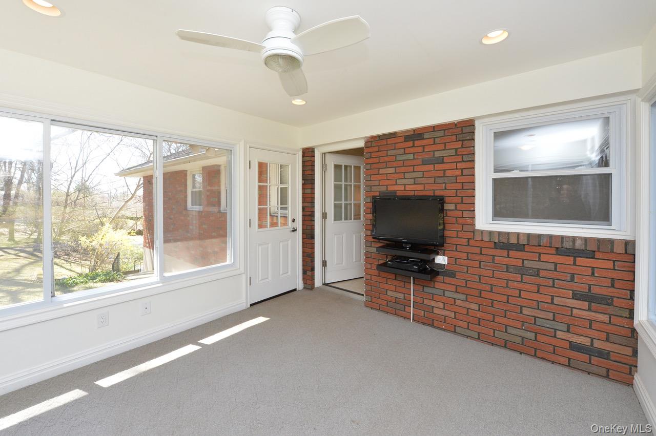 2 Augur Road Airmont, NY 10901 - Photo 11 of 34 an empty room with windows cabinet and flat screen tv