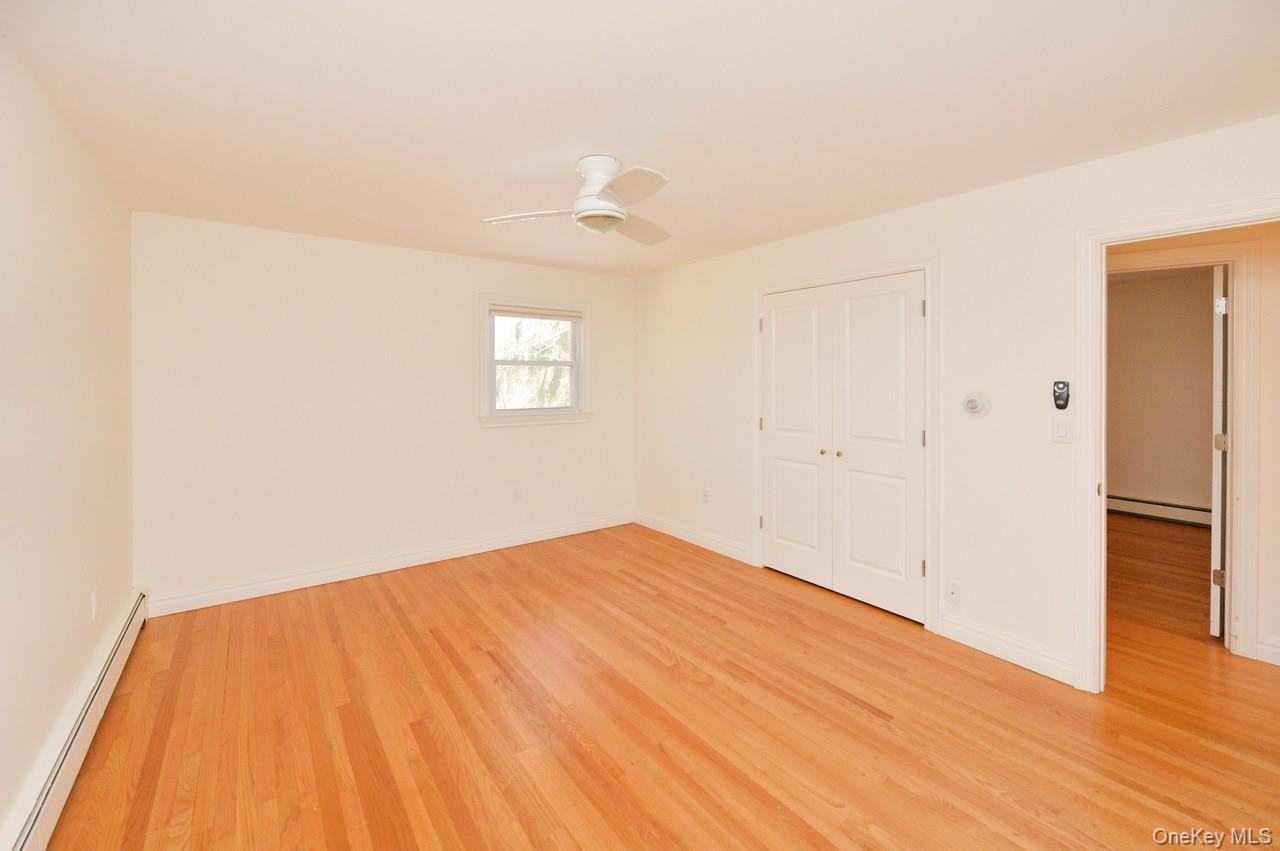 2 Augur Road Airmont, NY 10901 - Photo 26 of 34 a view of empty room with wooden floor and fan