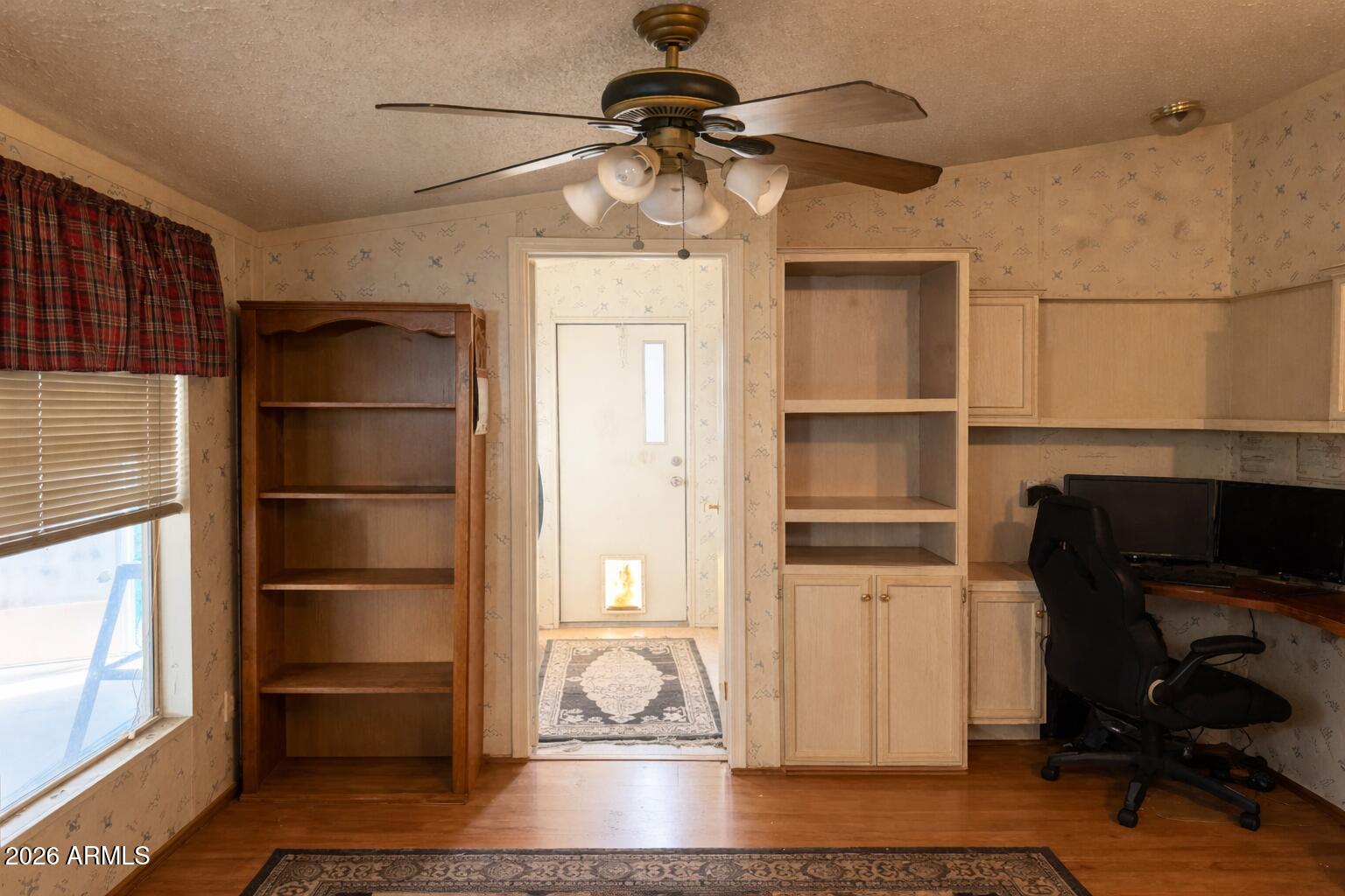 3700 South Tomahawk Road, Unit 99 Apache Junction, AZ 85119 - Photo 6 of 10 a view of a livingroom with furniture and a window