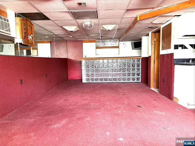 a view of a room with a fridge