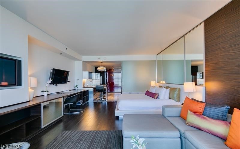 4381 West Flamingo Road, Unit 15310 Las Vegas, NV 89103 - Photo 14 of 52 Living area featuring dark wood finished floors