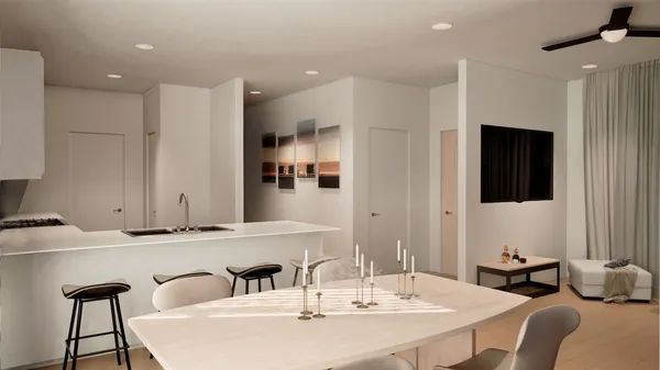 a kitchen with kitchen island stainless steel appliances kitchen island granite countertop a sink and a refrigerator