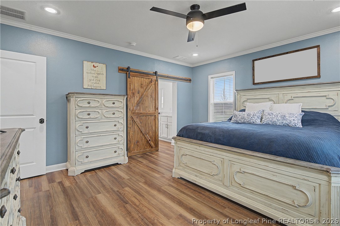 9109 Chicken Foot Road St. Pauls, NC 28384 - Photo 26 of 50 Farm door to master bath and Walk-in closet
