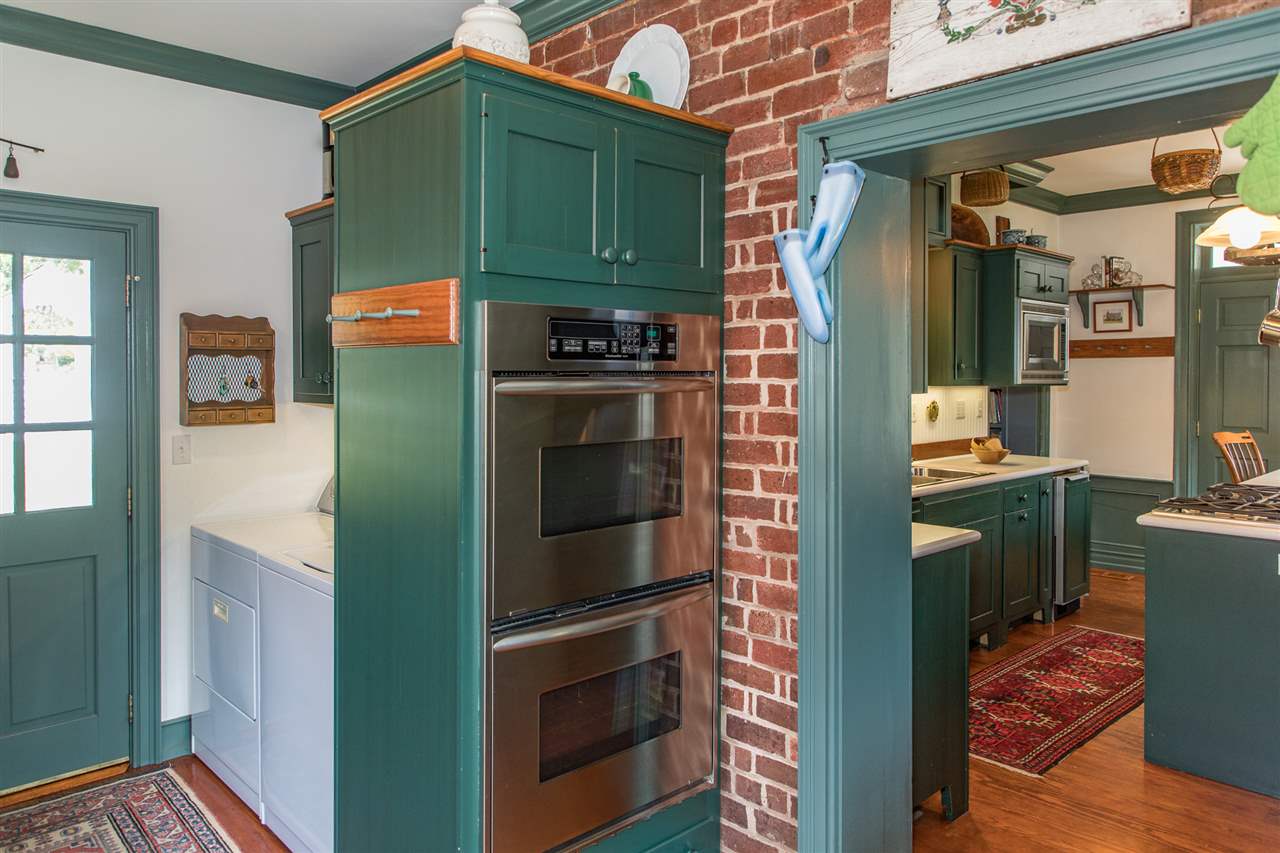 3938 Spring Hill Road Staunton, VA 24401 - Photo 20 of 50 a kitchen with a refrigerator and a stove top oven