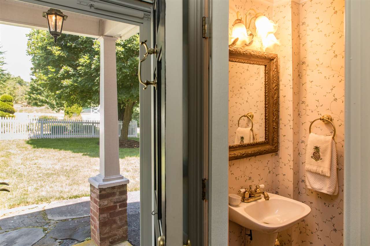3938 Spring Hill Road Staunton, VA 24401 - Photo 24 of 50 a bathroom with a sink mirror and a bathtub