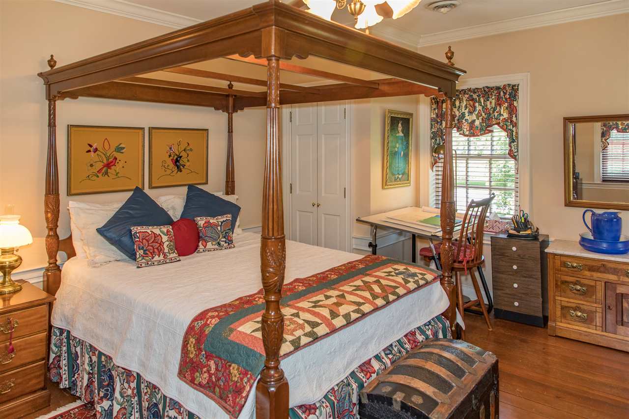 3938 Spring Hill Road Staunton, VA 24401 - Photo 27 of 50 a bedroom with a bed and a chandelier