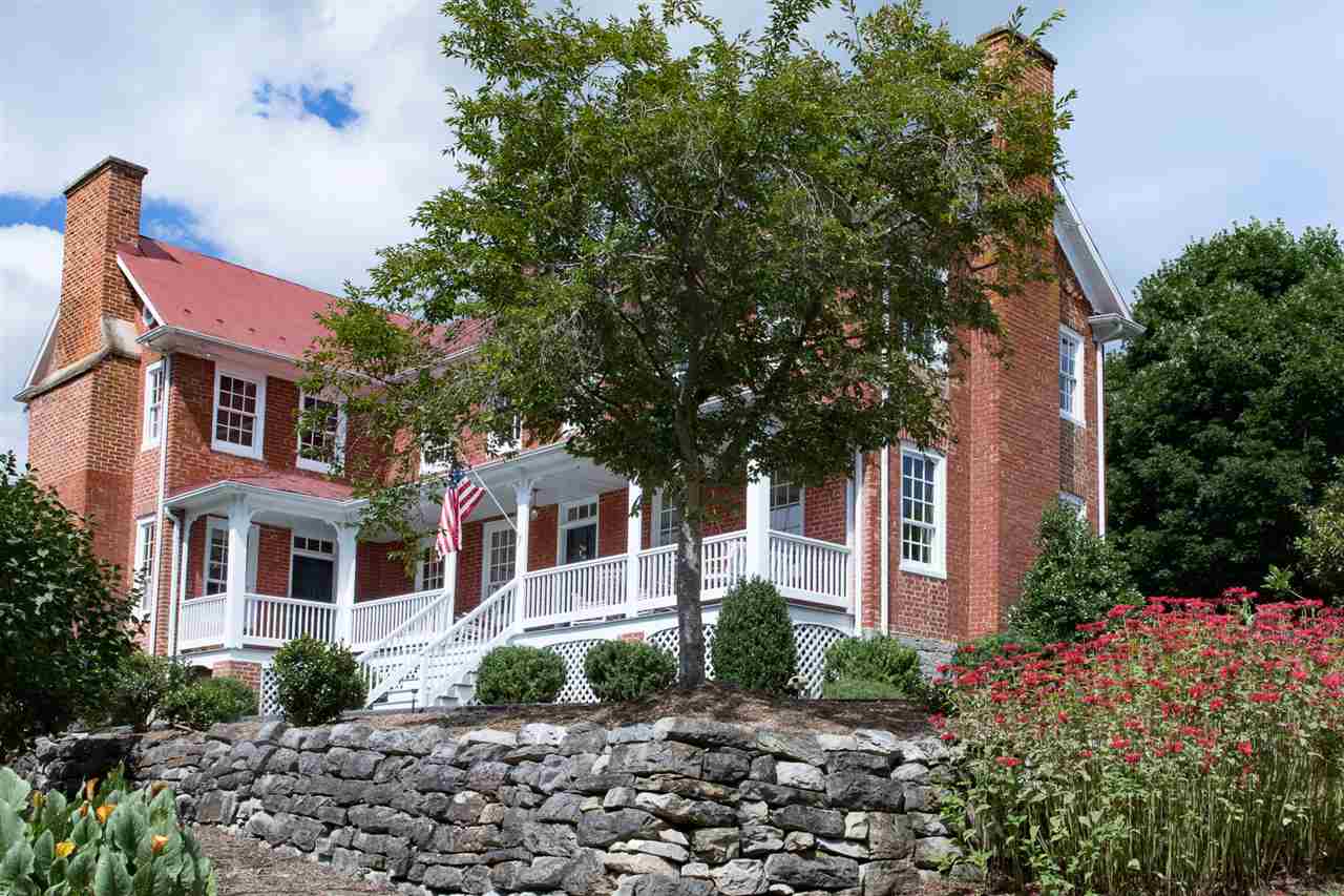 3938 Spring Hill Road Staunton, VA 24401 - Photo 3 of 50 a front view of a house with garden