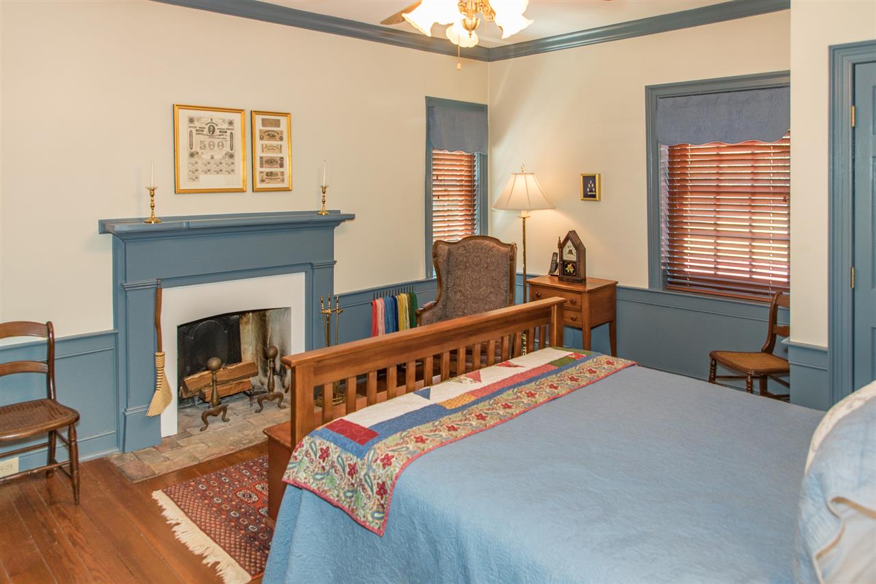 3938 Spring Hill Road Staunton, VA 24401 - Photo 34 of 50 a bedroom with furniture and a fireplace