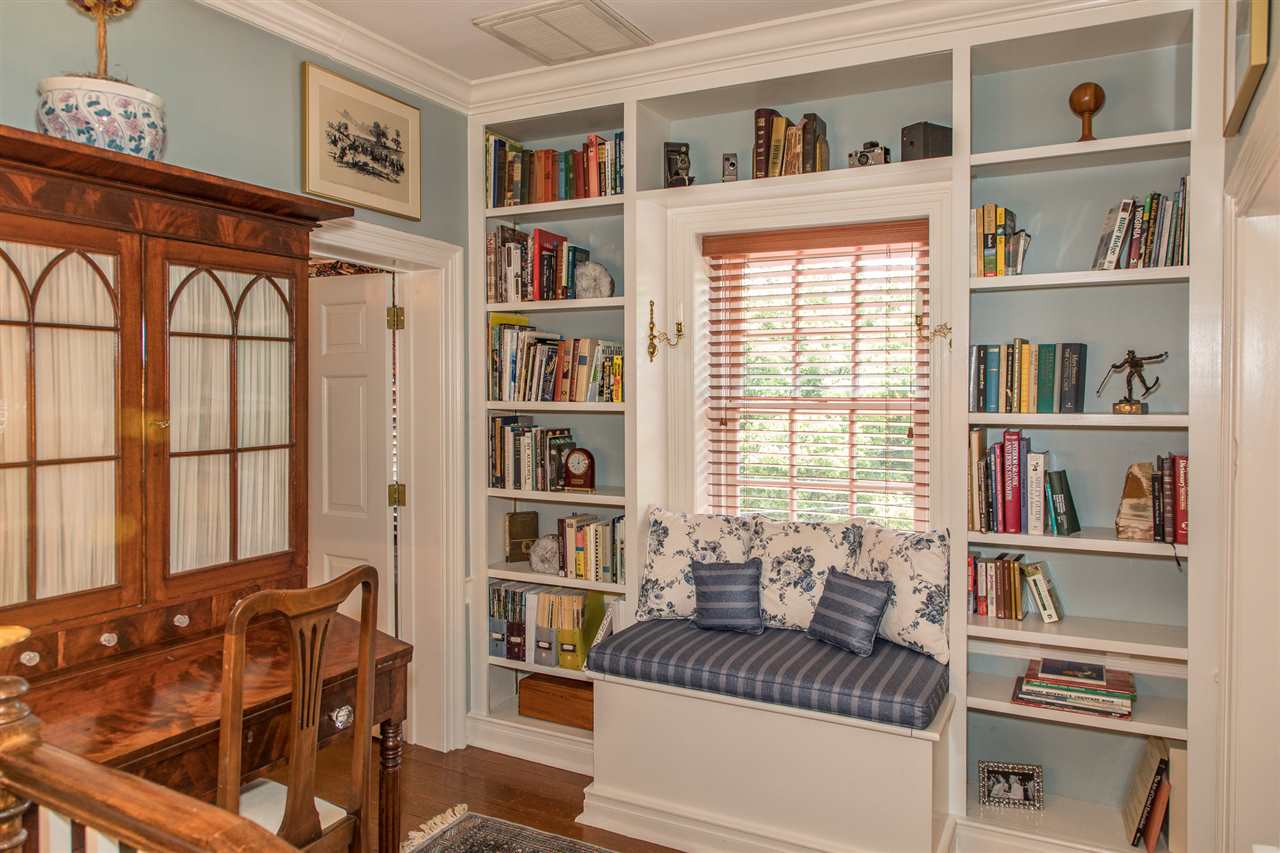 3938 Spring Hill Road Staunton, VA 24401 - Photo 37 of 50 a living room with furniture cabinets and a book shelf
