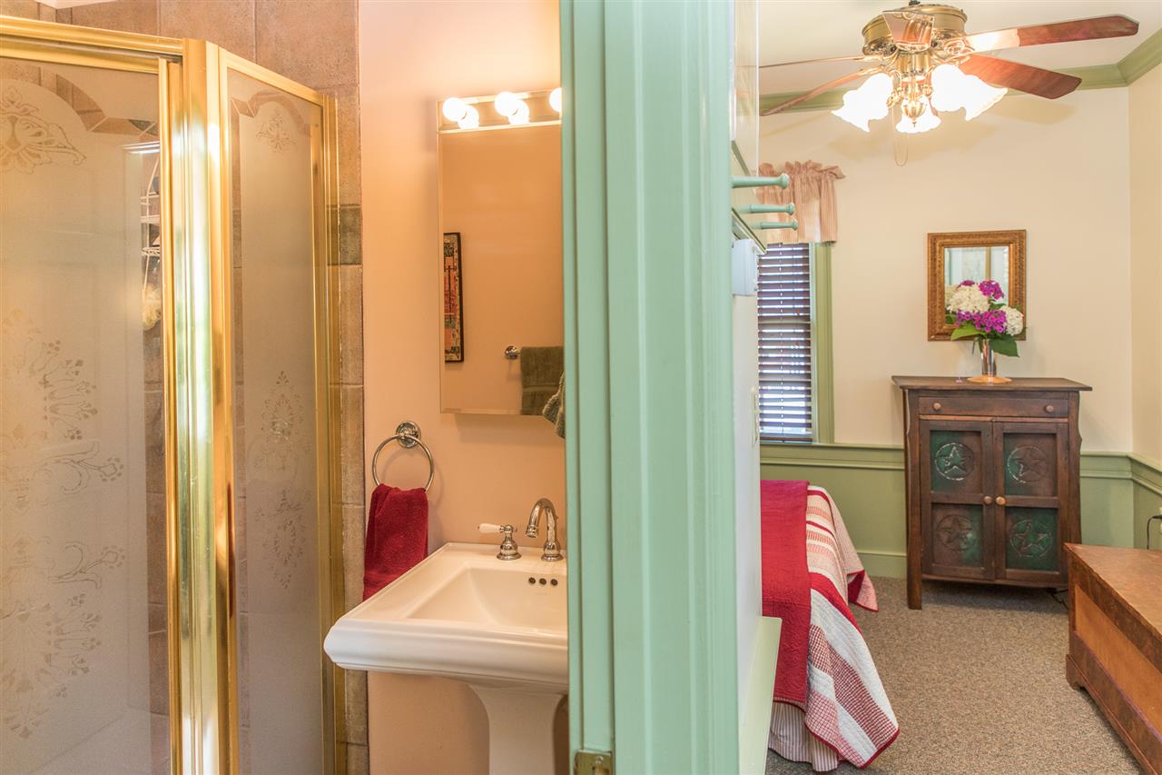3938 Spring Hill Road Staunton, VA 24401 - Photo 44 of 50 a bathroom with a sink tub and a mirror