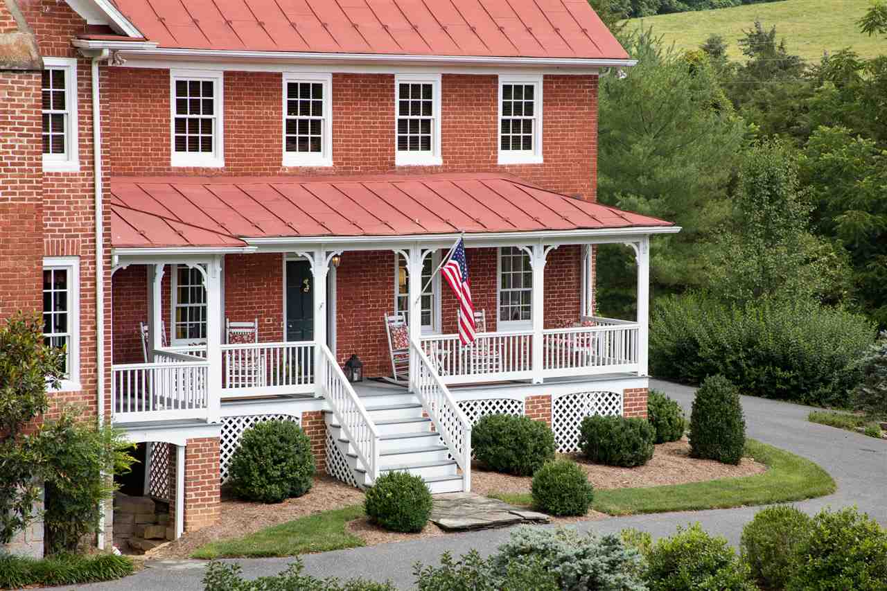 3938 Spring Hill Road Staunton, VA 24401 - Photo 6 of 50 a front view of a house with a yard and trees