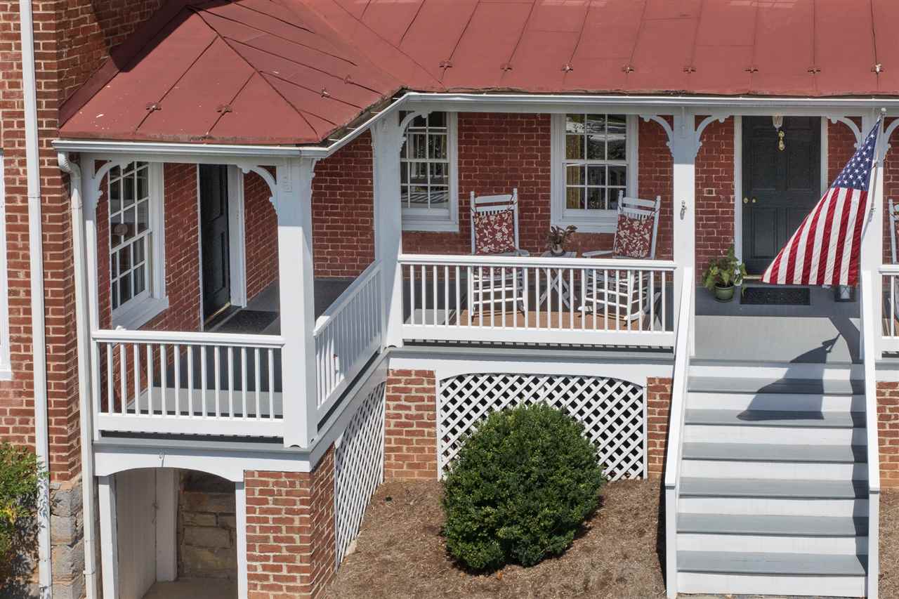 3938 Spring Hill Road Staunton, VA 24401 - Photo 7 of 50 a view of a house with wooden deck and a floor to ceiling window