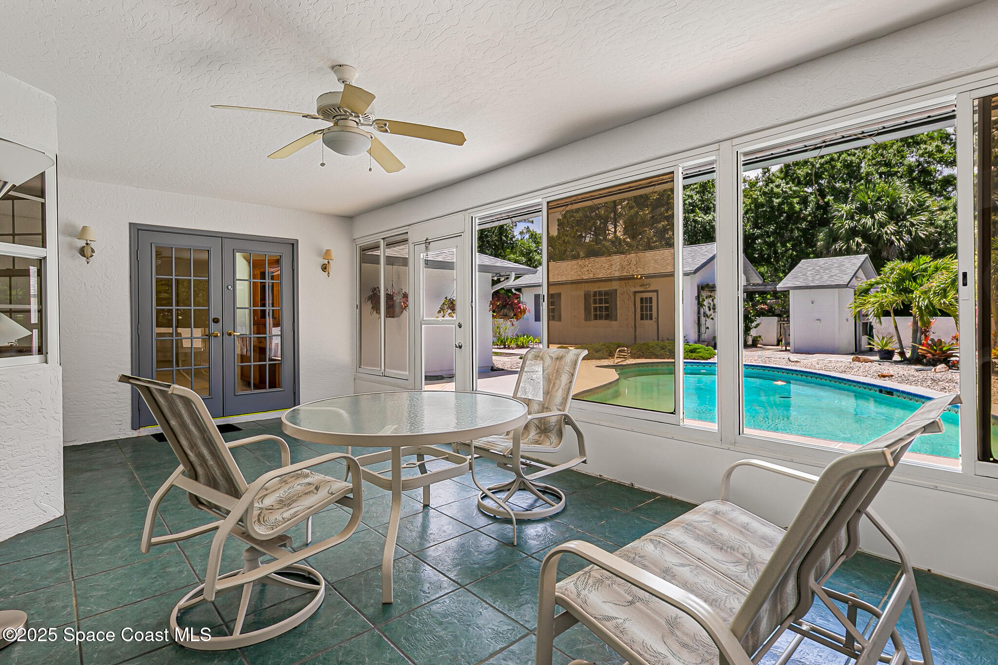 3340 Weber Road Malabar, FL 32950 - Photo 14 of 96 a view of a dining room with furniture wooden floor and a chandelier