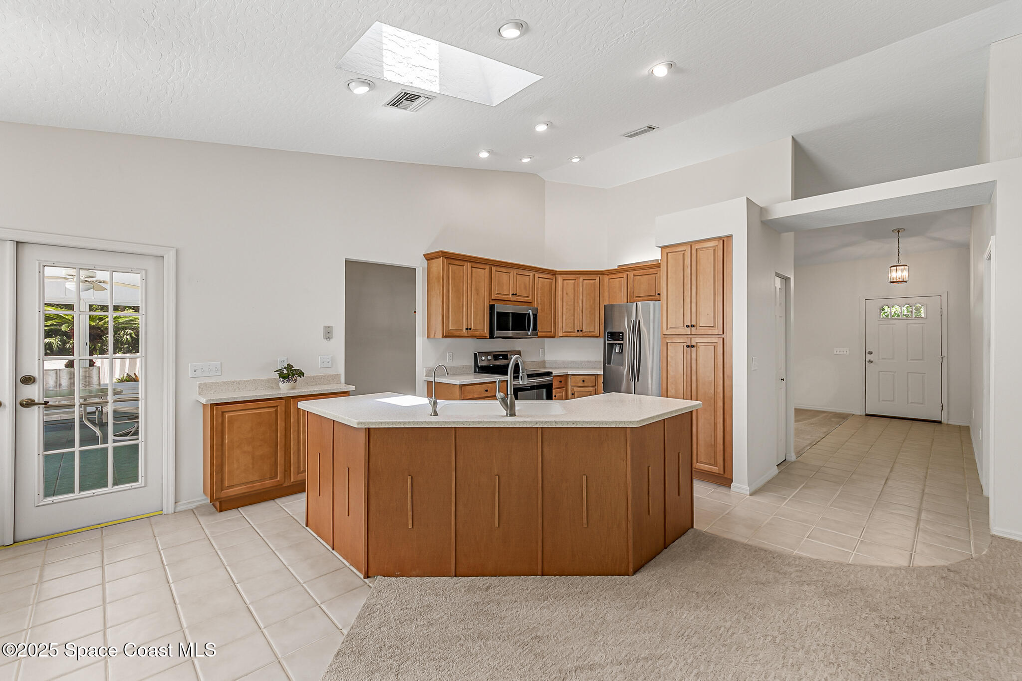 3340 Weber Road Malabar, FL 32950 - Photo 24 of 96 a view of kitchen with stainless steel appliances granite countertop a refrigerator and a stove top oven