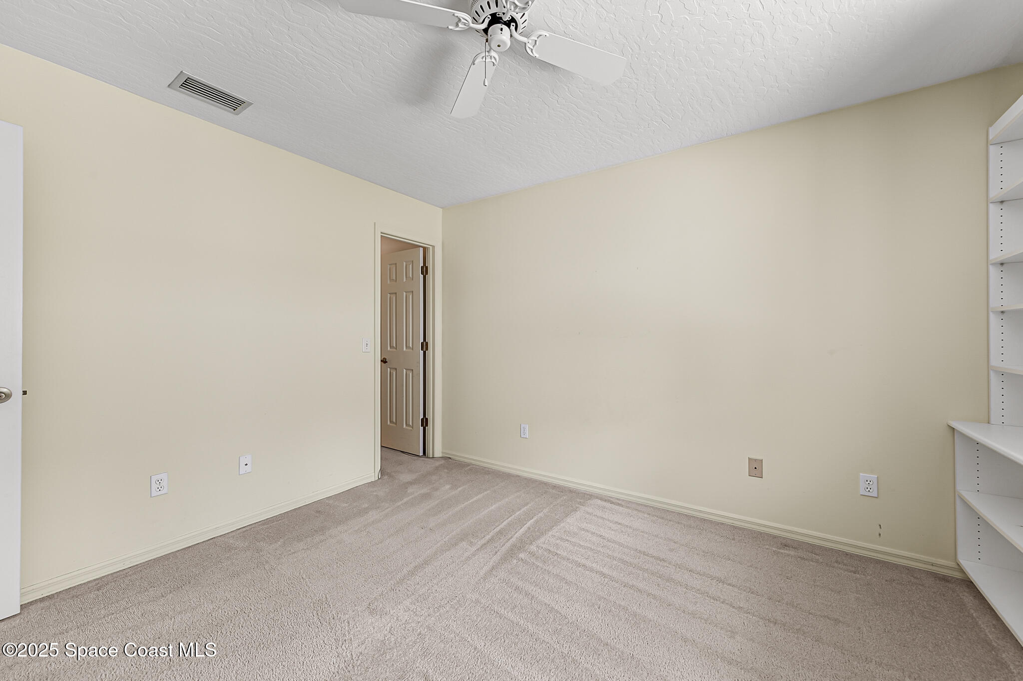3340 Weber Road Malabar, FL 32950 - Photo 41 of 96 a view of a room with a ceiling fan and wooden floor
