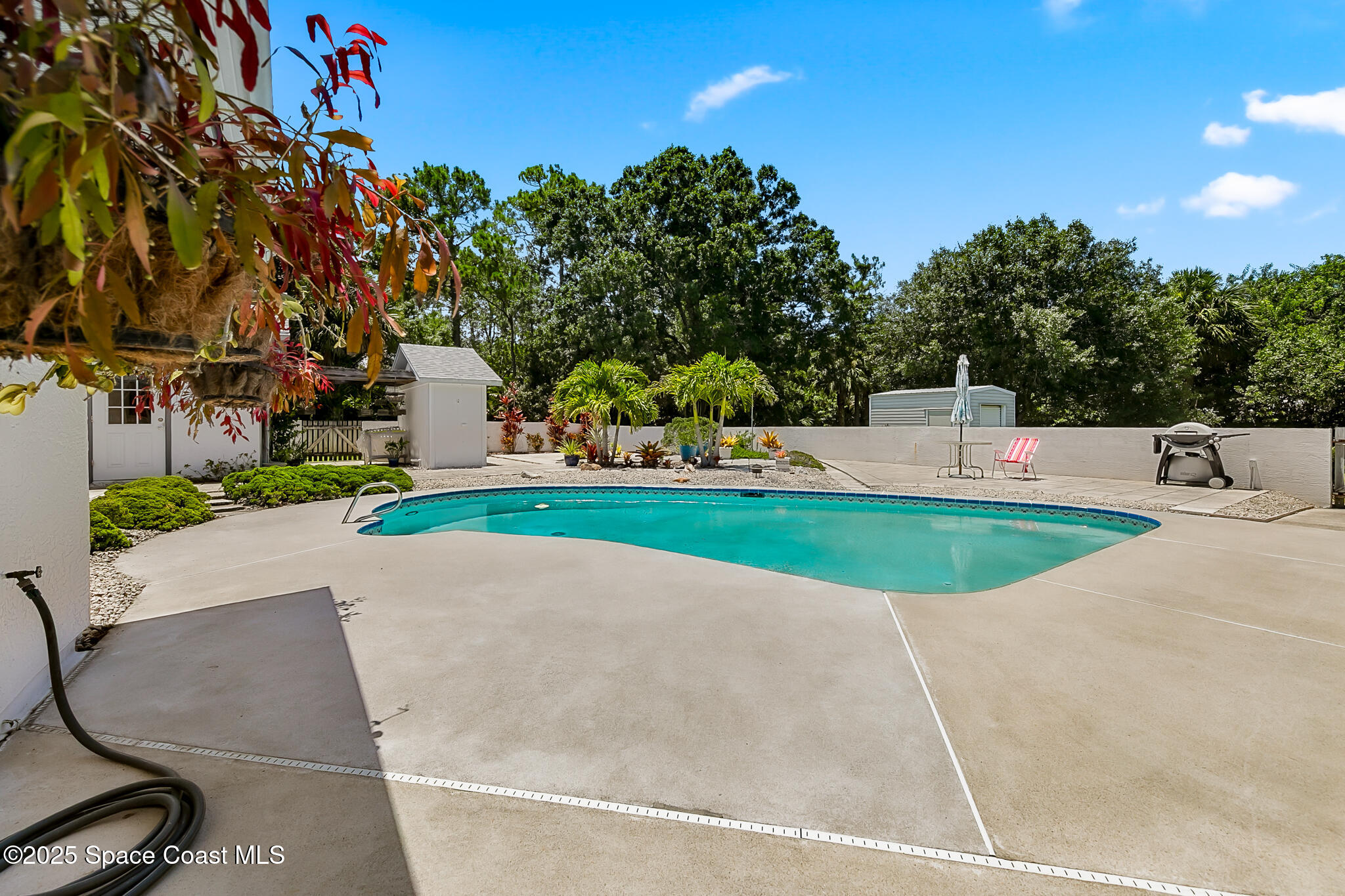 3340 Weber Road Malabar, FL 32950 - Photo 54 of 96 a view of a swimming pool with a yard