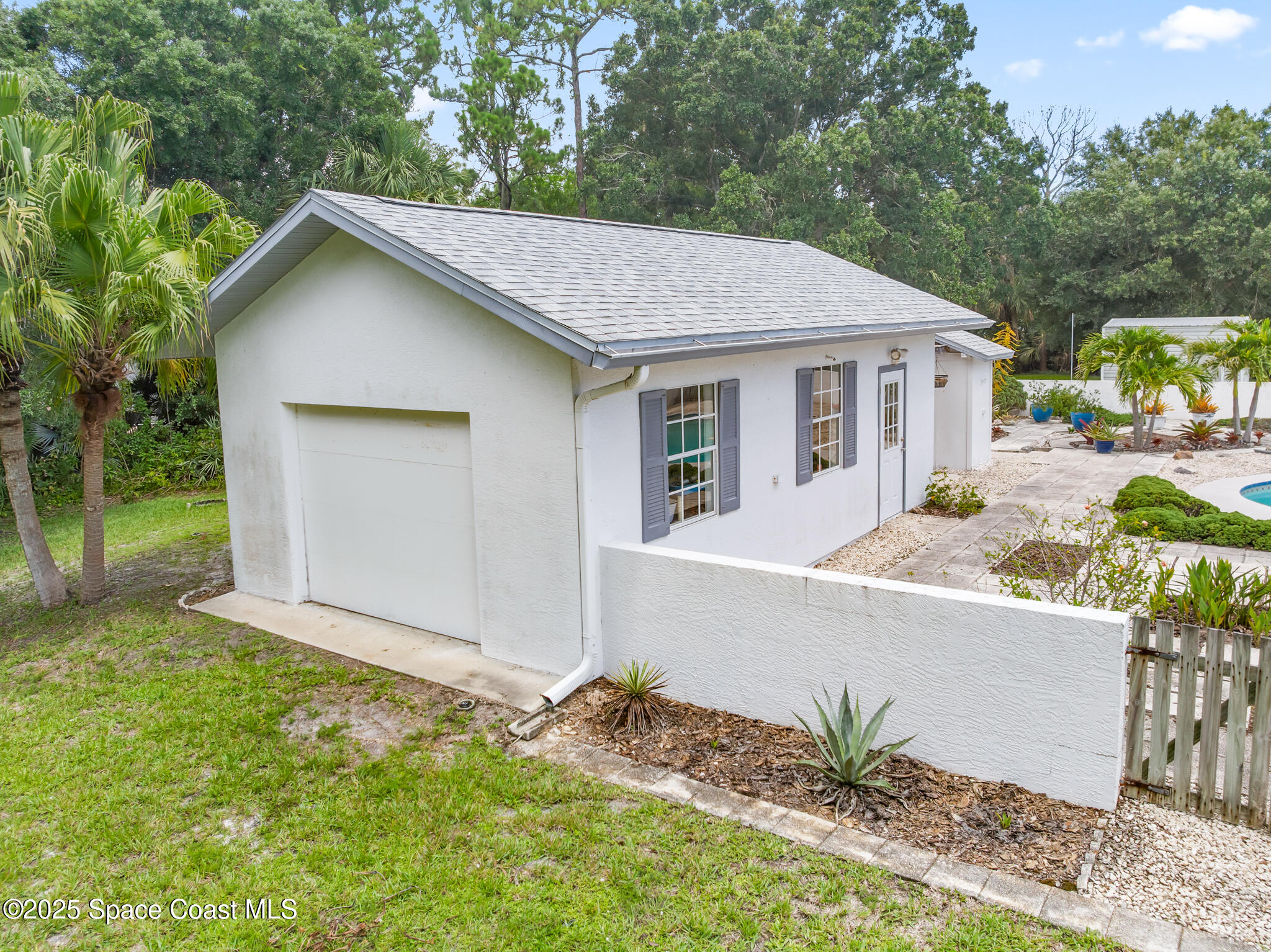 3340 Weber Road Malabar, FL 32950 - Photo 63 of 96 a front view of house with yard and trees in the background