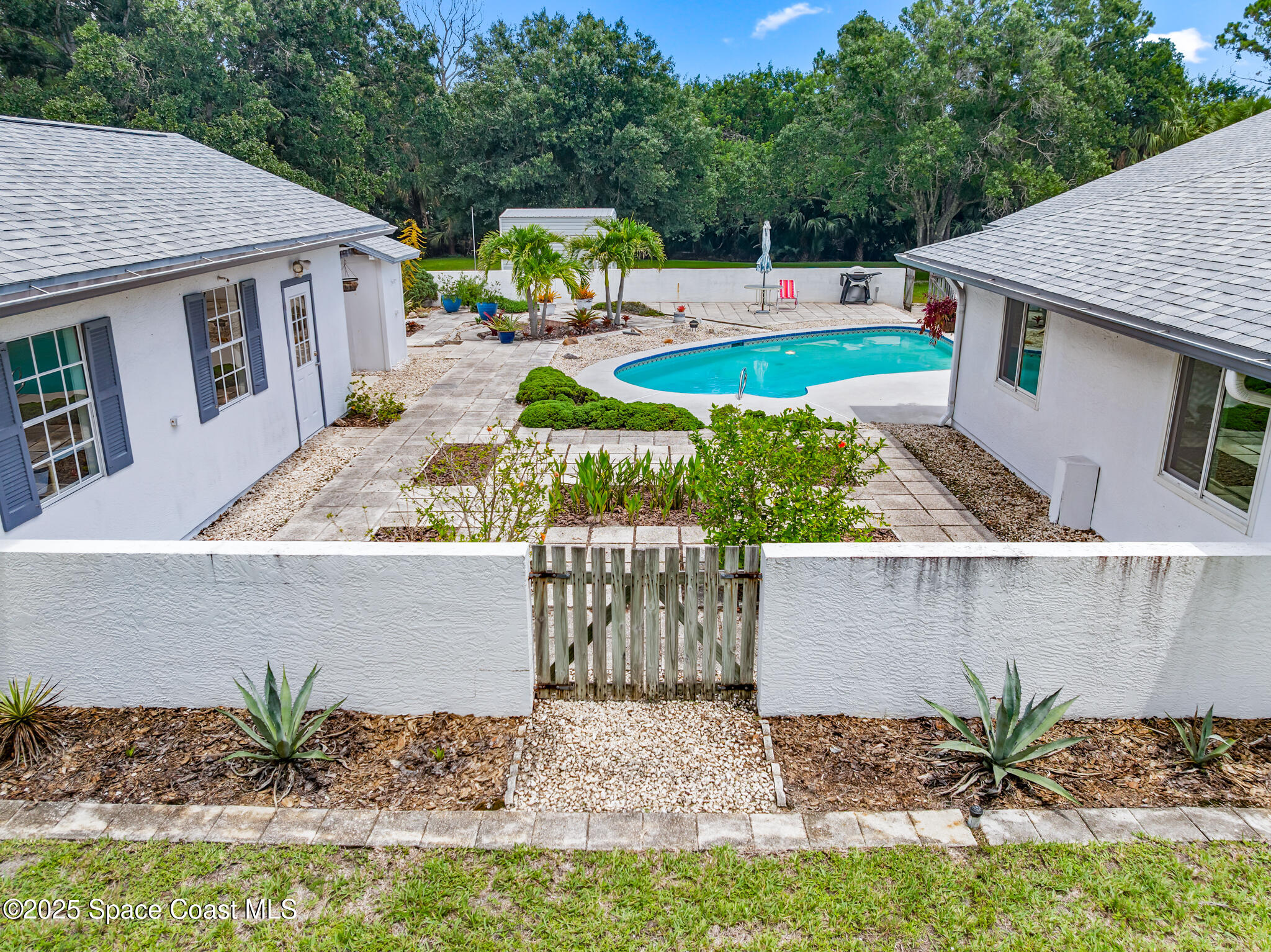 3340 Weber Road Malabar, FL 32950 - Photo 64 of 96 an aerial view of a house with garden space and sitting area