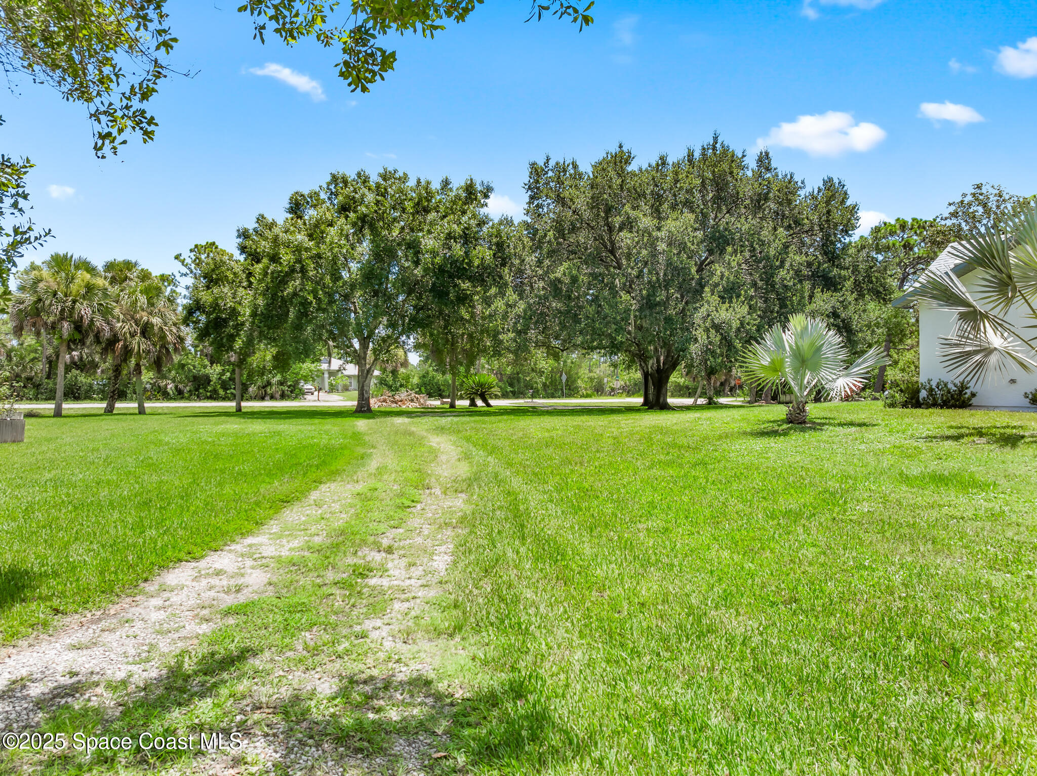 3340 Weber Road Malabar, FL 32950 - Photo 78 of 96 a view of grassy field with benches