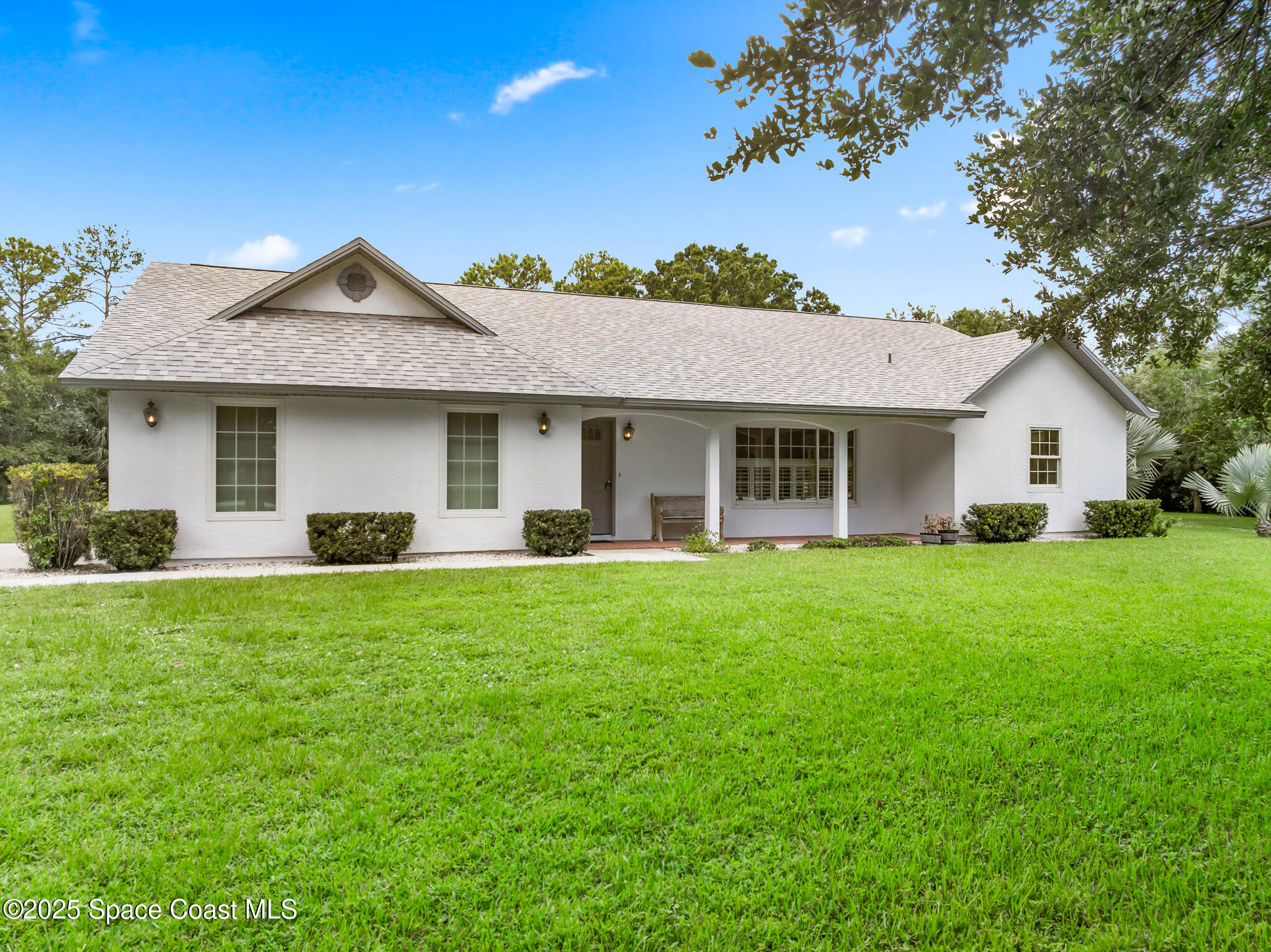 3340 Weber Road Malabar, FL 32950 - Photo 93 of 96 a front view of a house with a garden