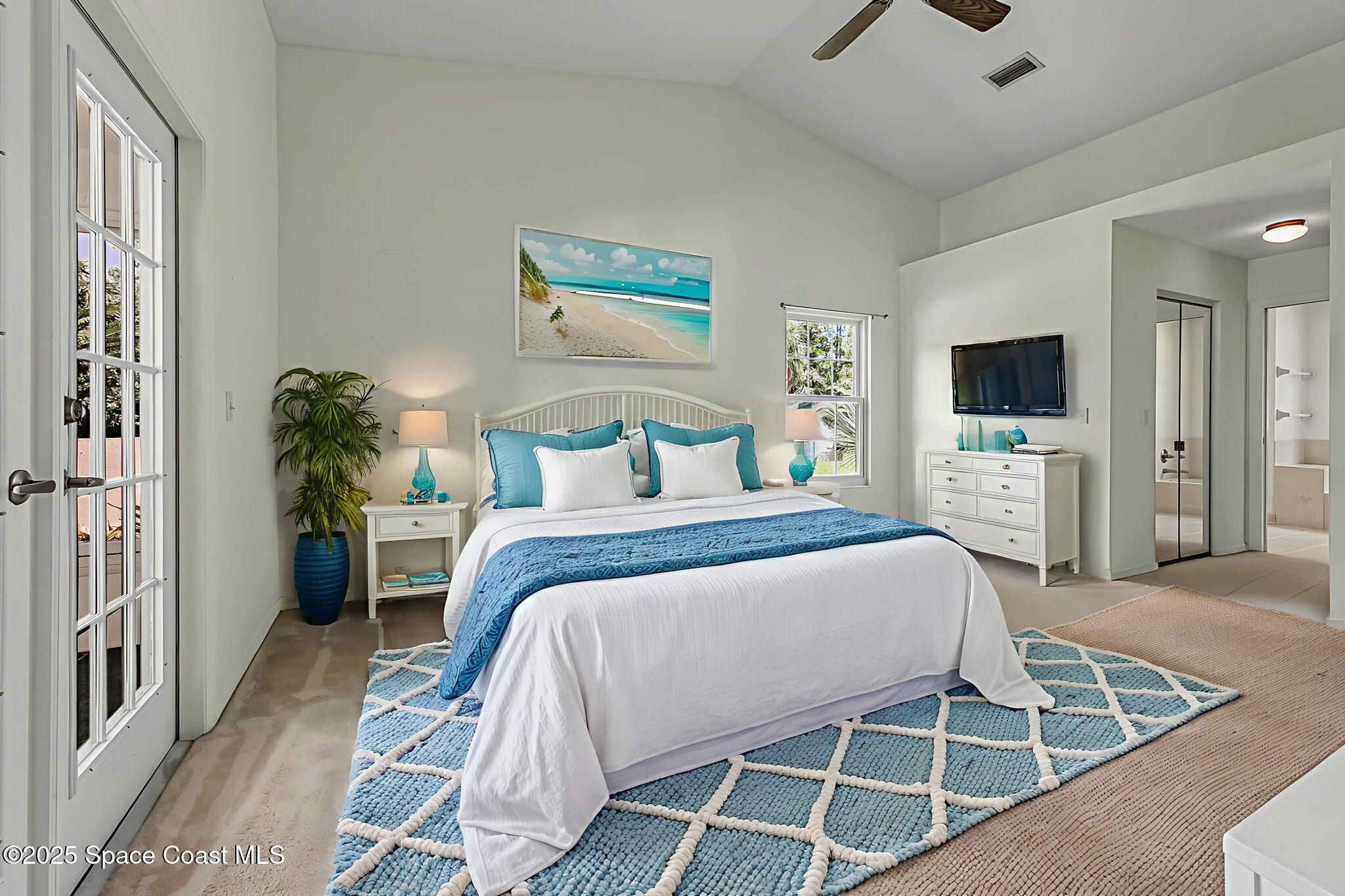3340 Weber Road Malabar, FL 32950 - Photo 10 of 96 a bedroom with a bed and a flat tv screen on dresser