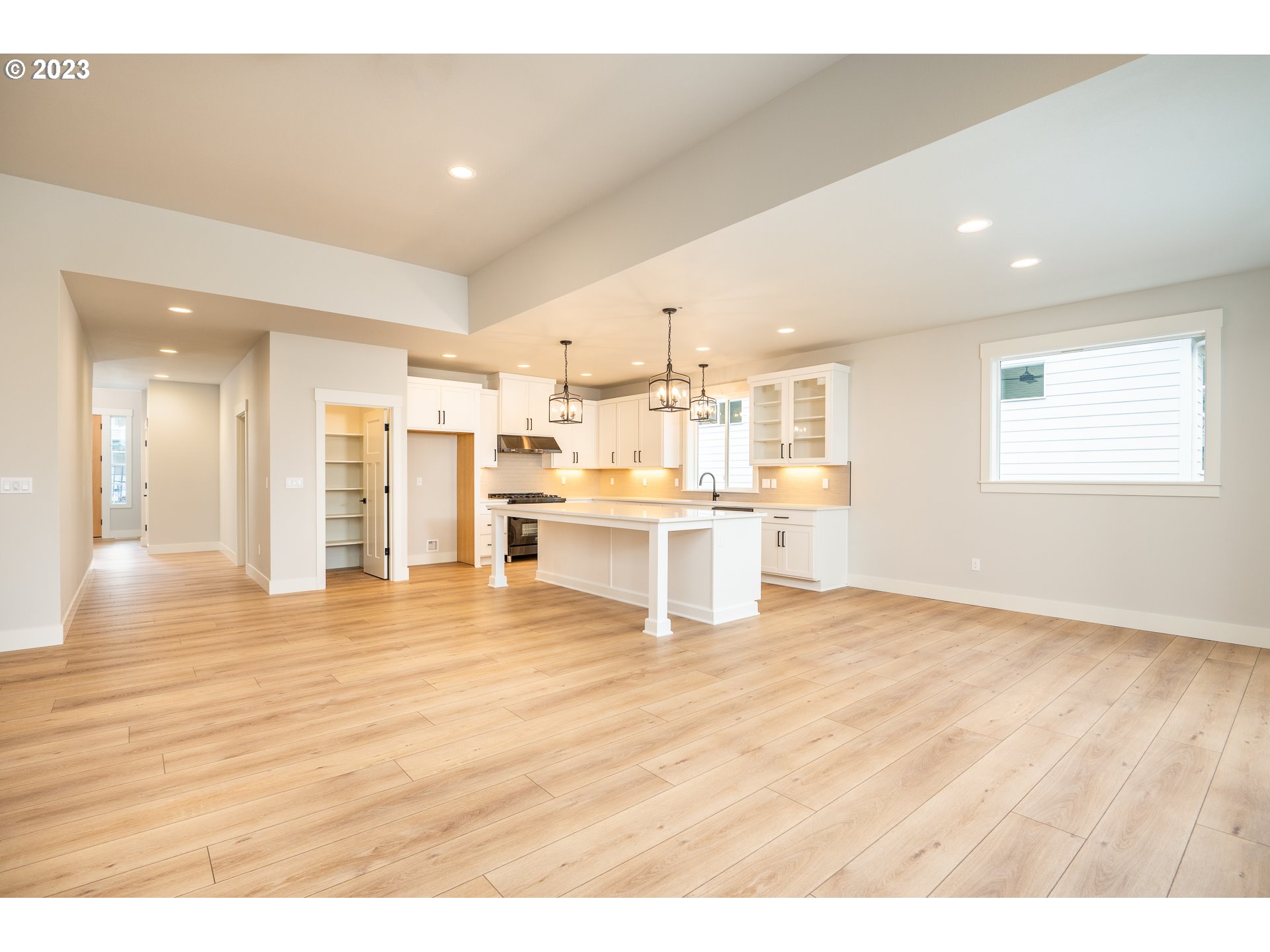 37772 Southeast Olson Street Sandy, OR 97055 - Photo 16 of 32 a view of kitchen with kitchen island a sink wooden floor and view living room