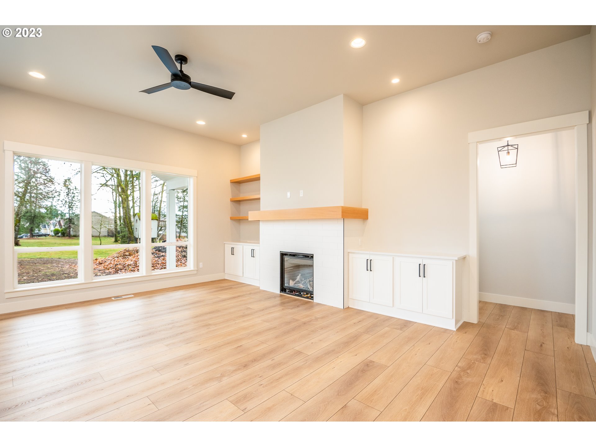 37772 Southeast Olson Street Sandy, OR 97055 - Photo 4 of 32 a view of an empty room with window and wooden floor