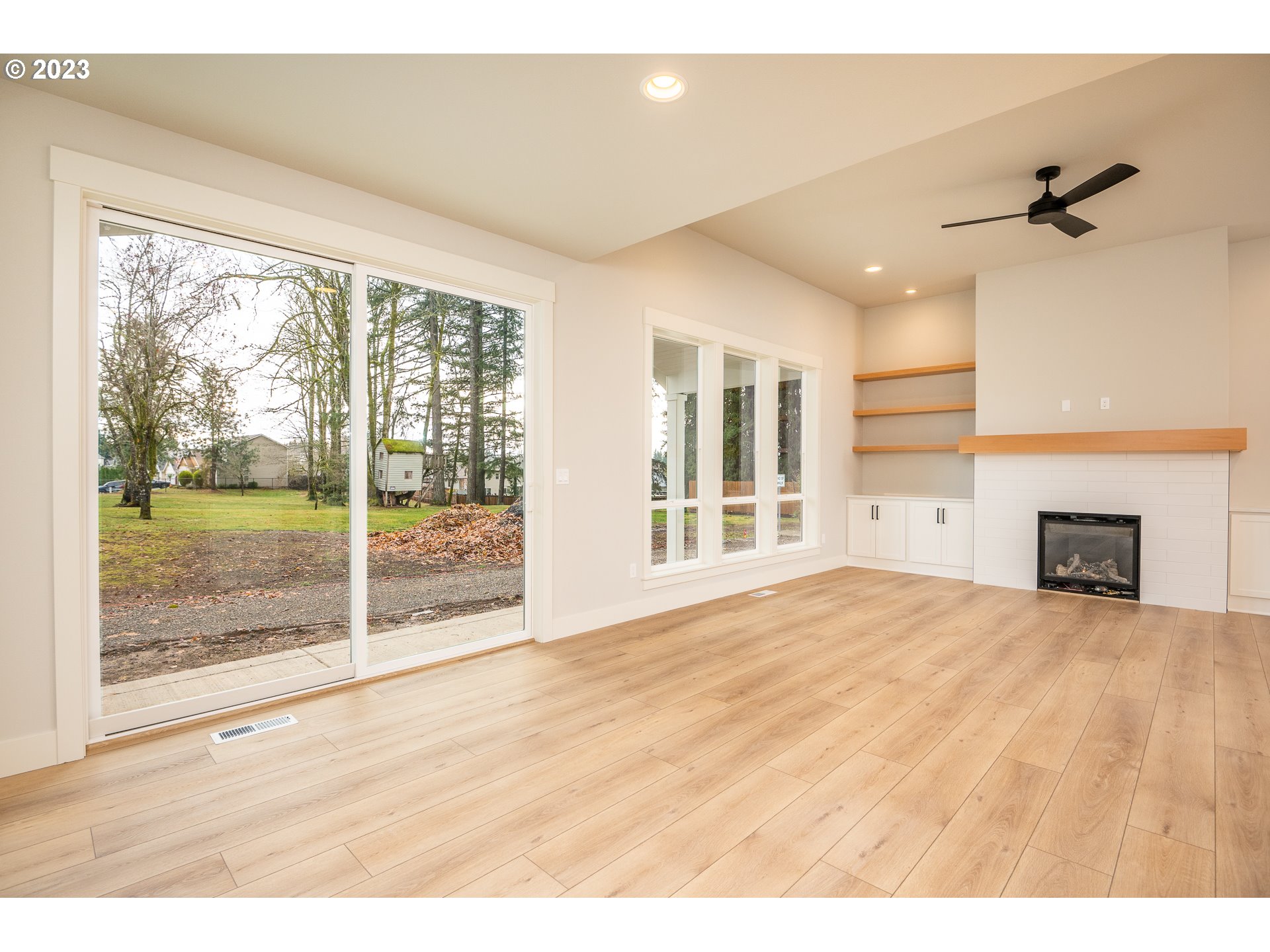 37772 Southeast Olson Street Sandy, OR 97055 - Photo 6 of 32 a view of an empty room with wooden floor and a window