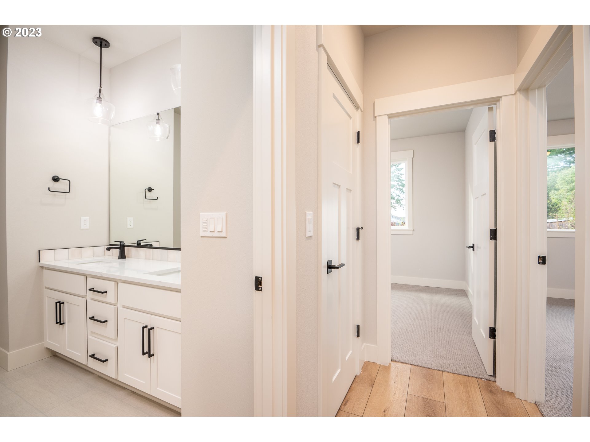 37772 Southeast Olson Street Sandy, OR 97055 - Photo 7 of 32 a bathroom with a double vanity sink a mirror and a shower