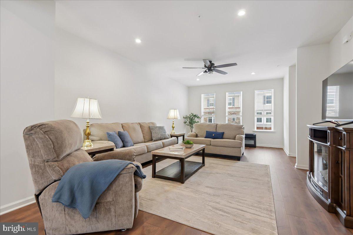 1813 Iris Lane Hanover, MD 21076 - Photo 11 of 20 a living room with furniture and a fireplace