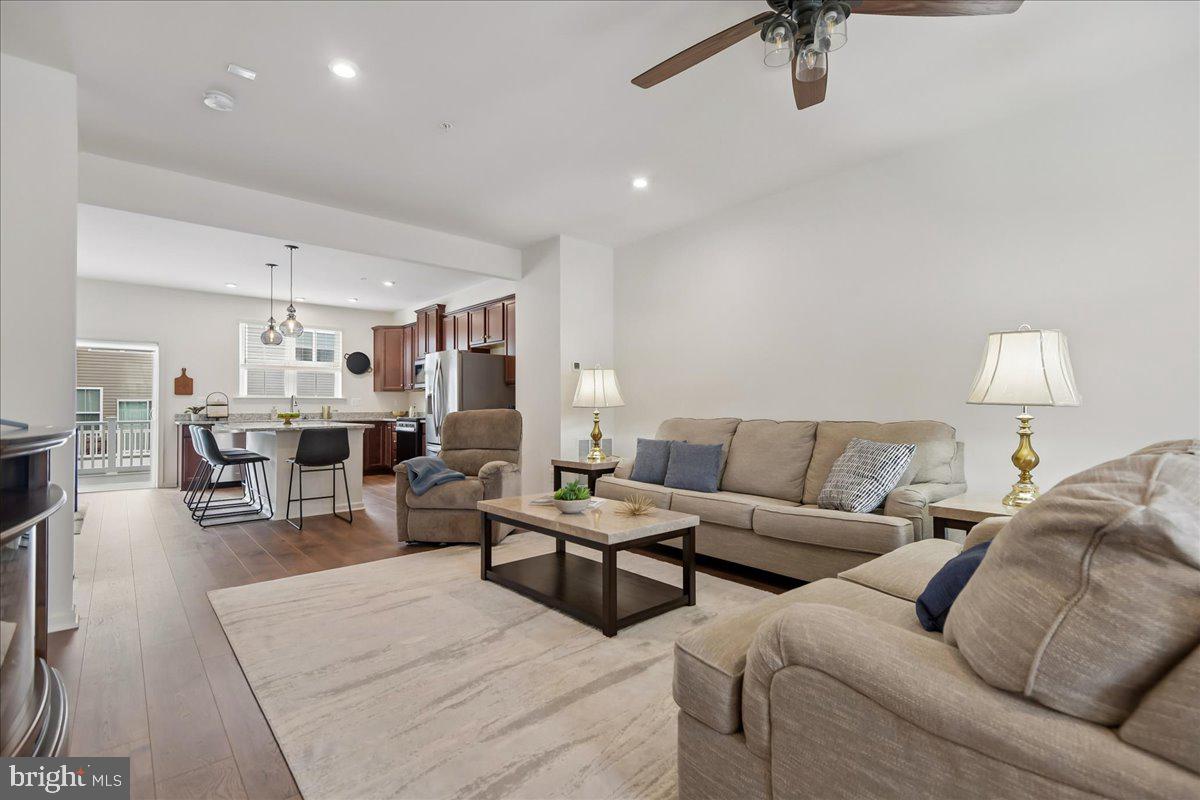 1813 Iris Lane Hanover, MD 21076 - Photo 12 of 20 a living room with furniture and a lamp