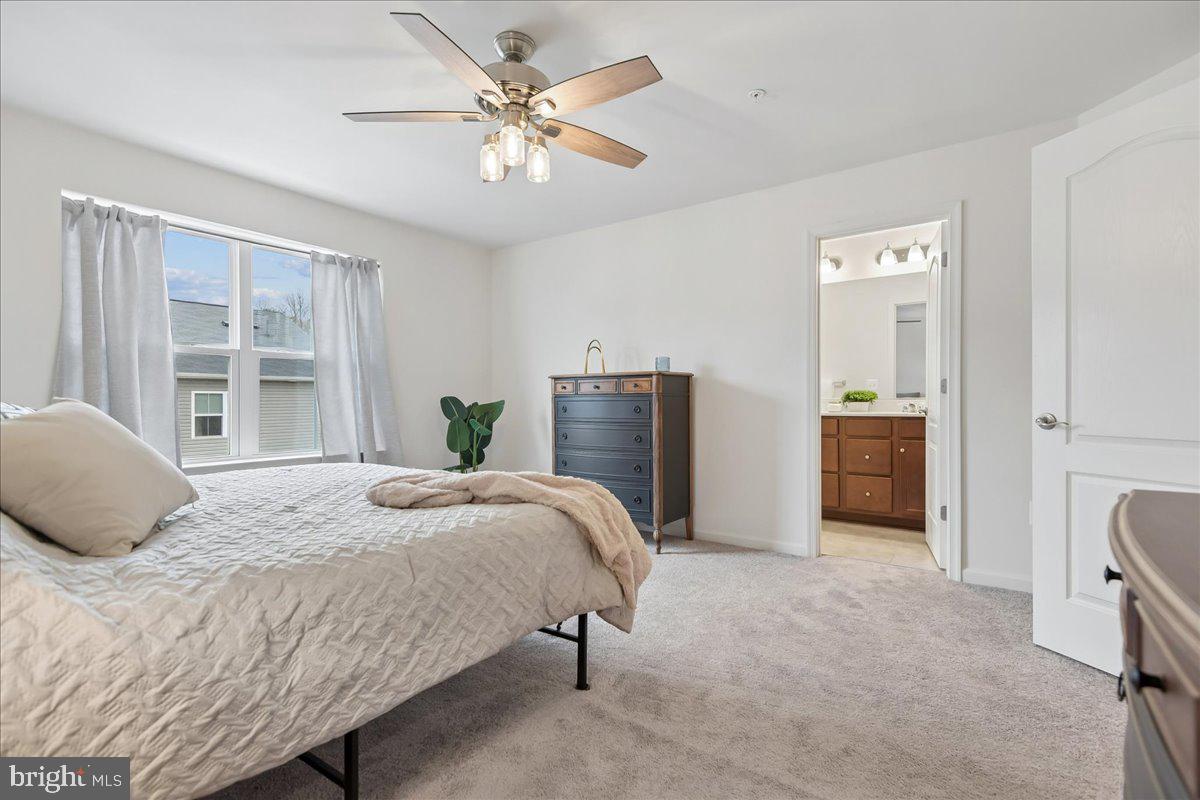 1813 Iris Lane Hanover, MD 21076 - Photo 15 of 20 a bedroom with a bed and a chandelier