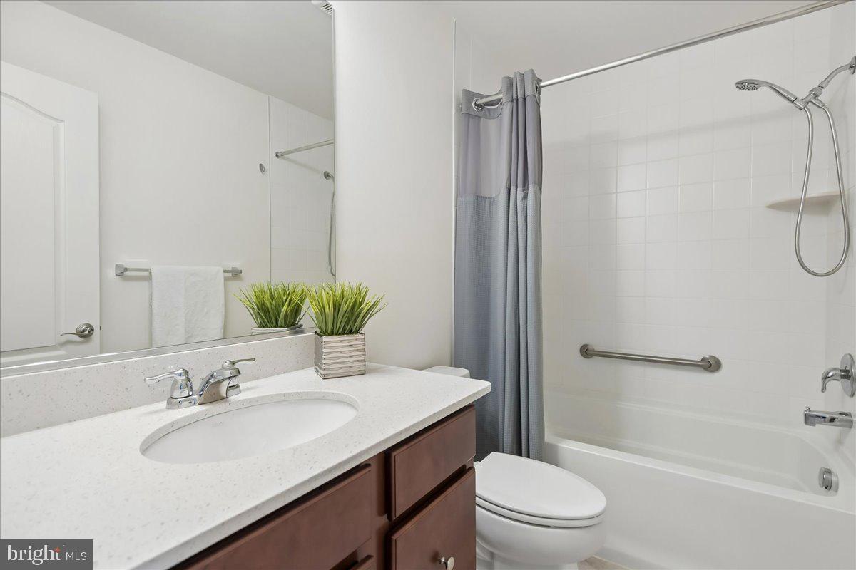 1813 Iris Lane Hanover, MD 21076 - Photo 18 of 20 a bathroom with a sink toilet and shower