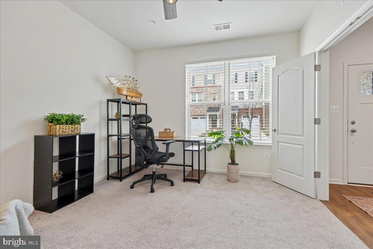 1813 Iris Lane Hanover, MD 21076 - Photo 4 of 20 a view of a livingroom with furniture and a window
