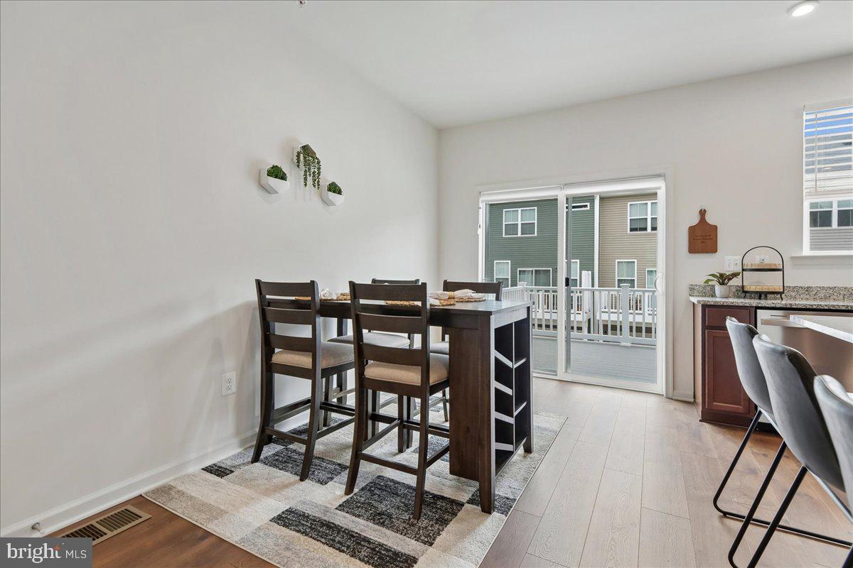 1813 Iris Lane Hanover, MD 21076 - Photo 8 of 20 a view of a workspace with furniture and wooden floor