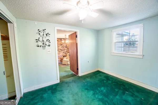 wooden floor in an empty room and a window