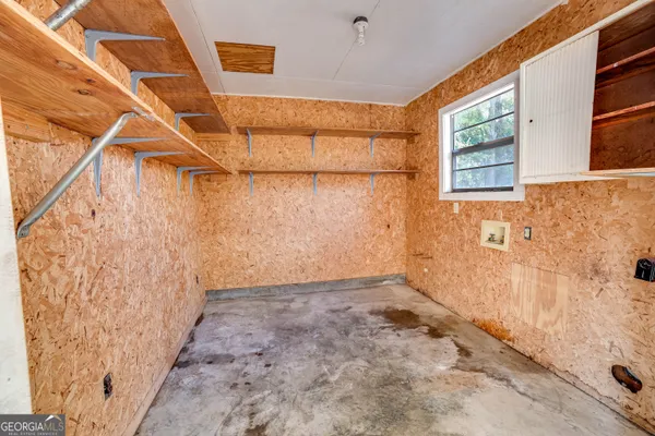 a view of a room with wooden floor and balcony