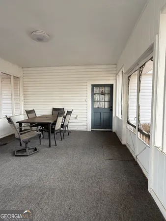 a view of an empty room and window