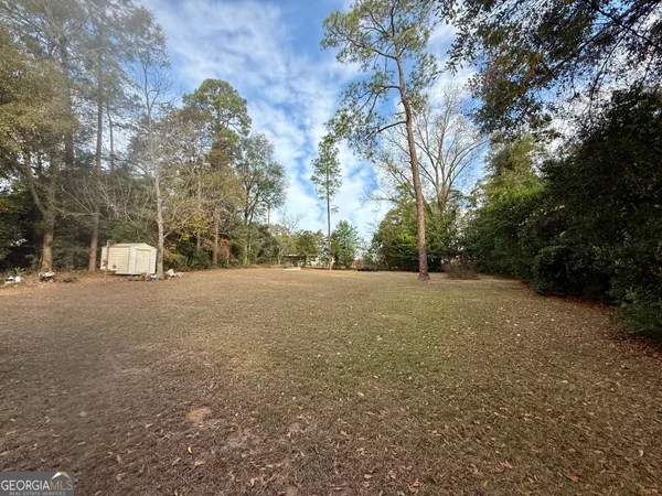 a view of a house with a big yard