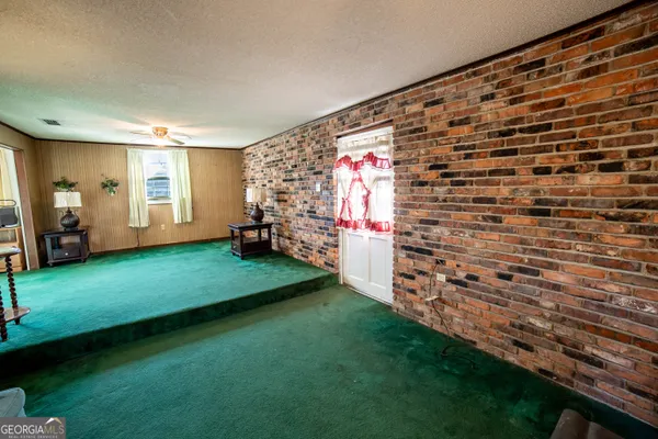 a view of an empty room with windows