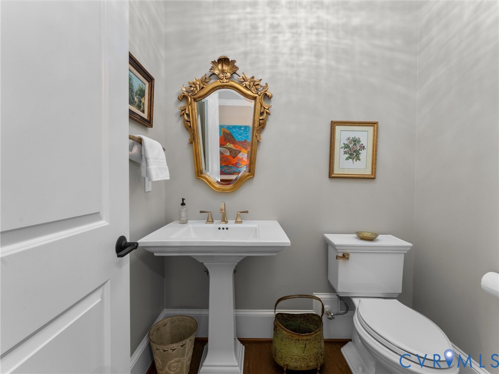 16131 Binley Road Midlothian, VA 23112 - Photo 41 of 99 a bathroom with a toilet sink and mirror