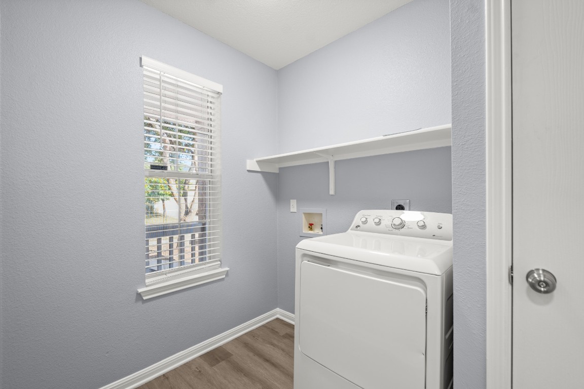 14303 Cummins Way Manor, TX 78653 - Photo 12 of 25 a utility room with dryer and washer