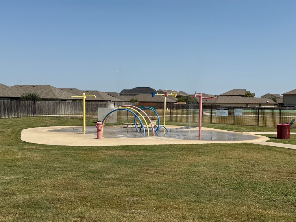 14303 Cummins Way Manor, TX 78653 - Photo 22 of 25 a view of a swimming pool with a lake