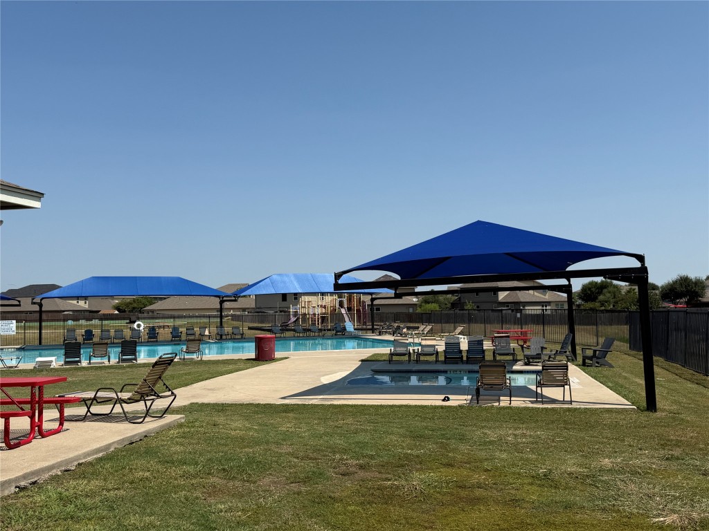 14303 Cummins Way Manor, TX 78653 - Photo 25 of 25 a view of swimming pool with seating area and furniture